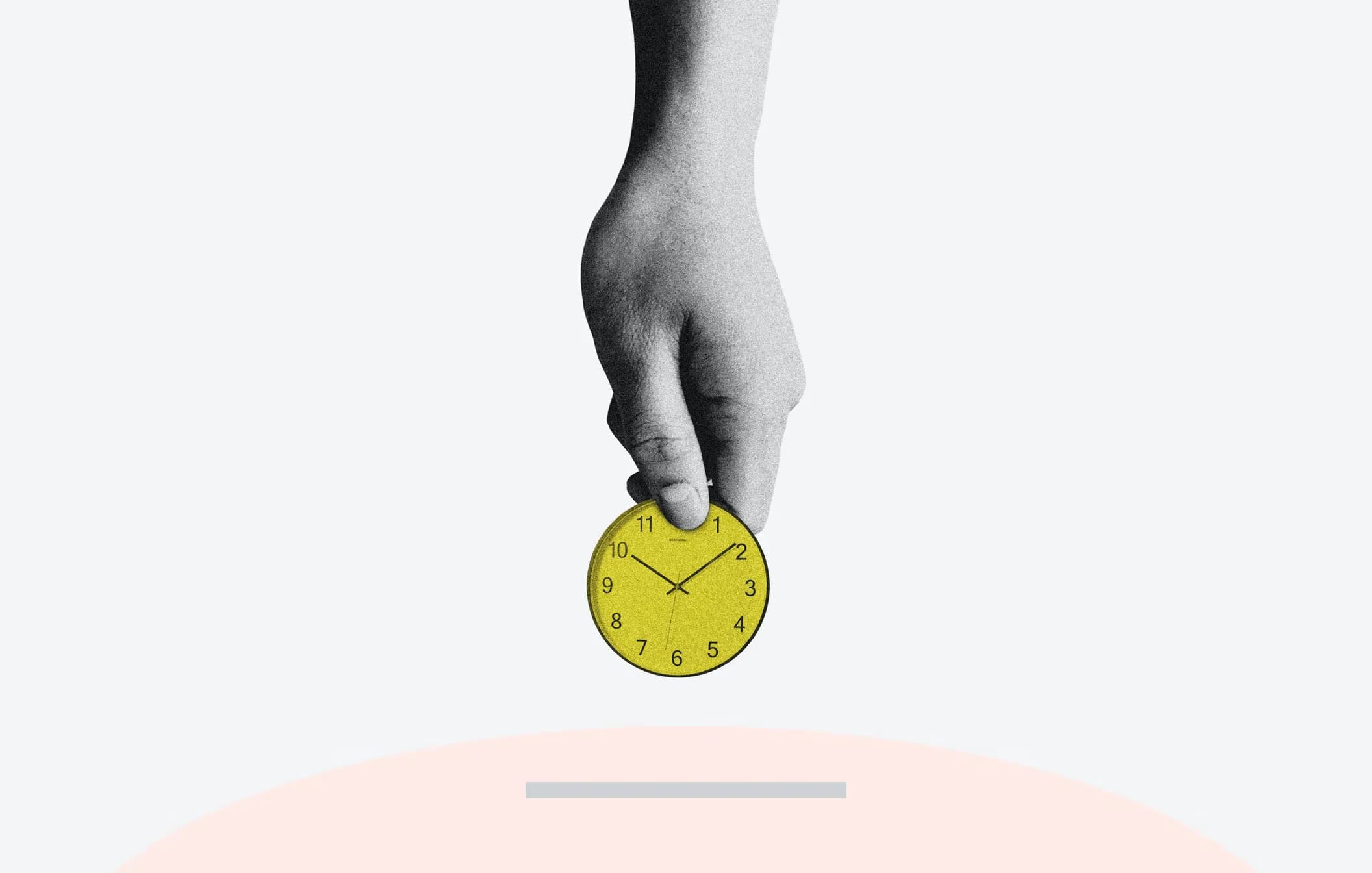 A hand holding a coin